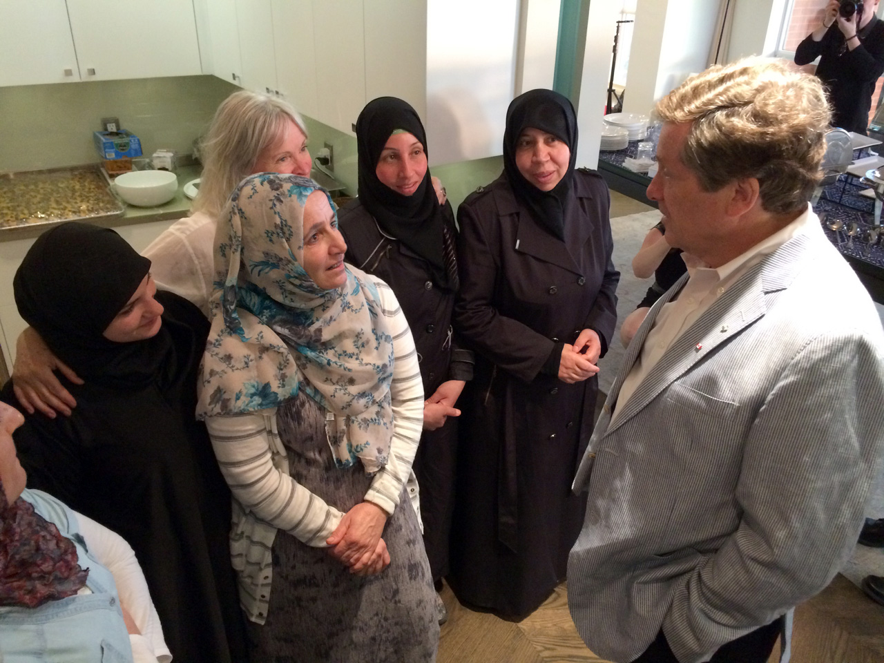 Mayor John Tory meets the Newcomer Kitchen cooks.